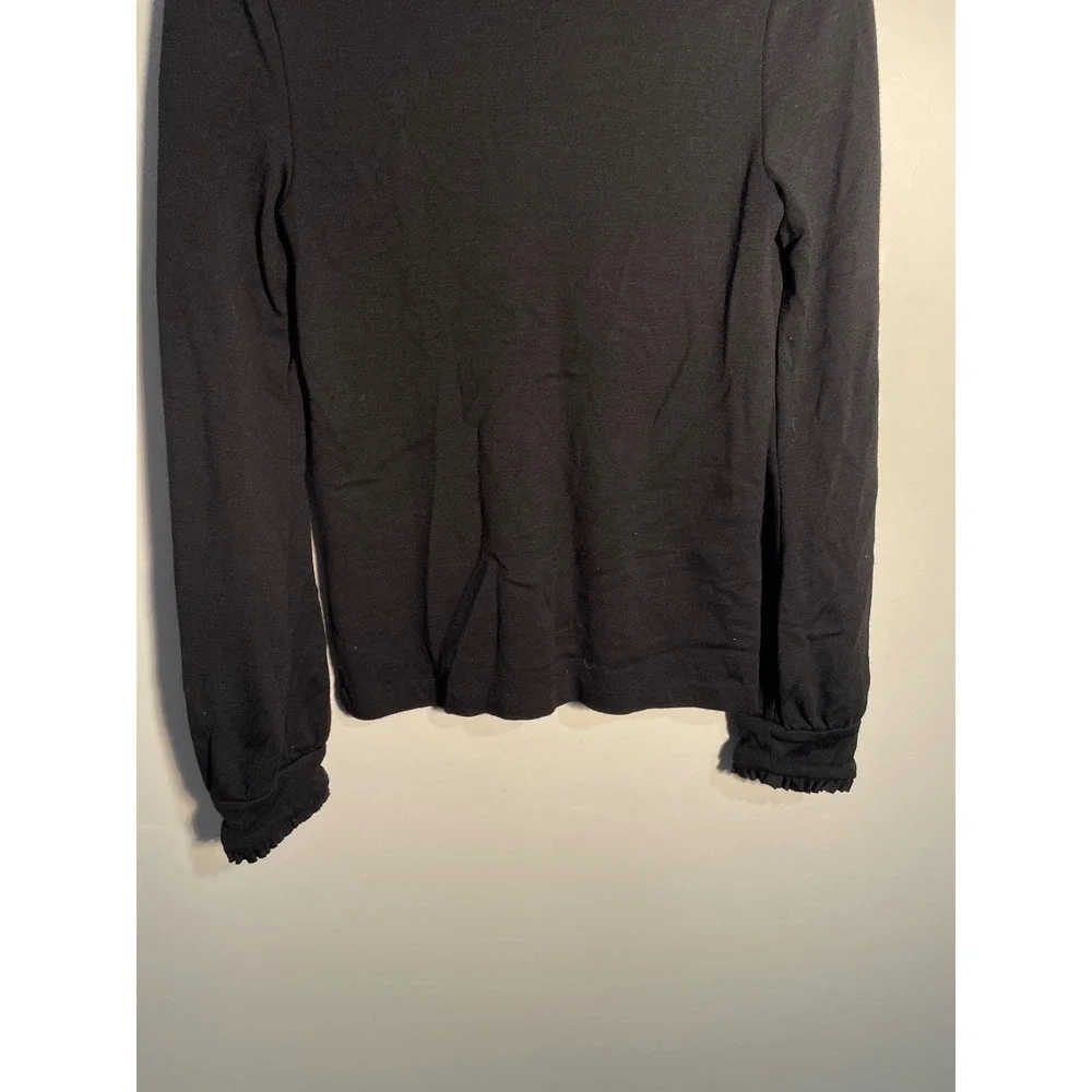 Diane von Furstenberg Black Wool Turtleneck‎ Ruffle Hem Top Size 10 Quiet Luxury